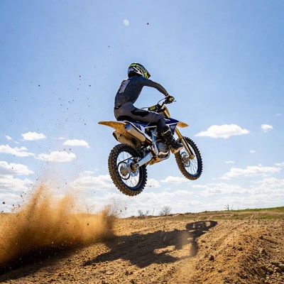 Motocross rider jumping dirt bike