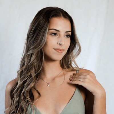 Woman with long wavy hair smiling
