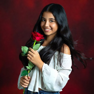 Girl holding red rose