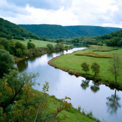 River Winding Through Green Valley