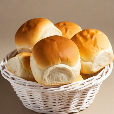 Fresh Dinner Rolls in White Basket