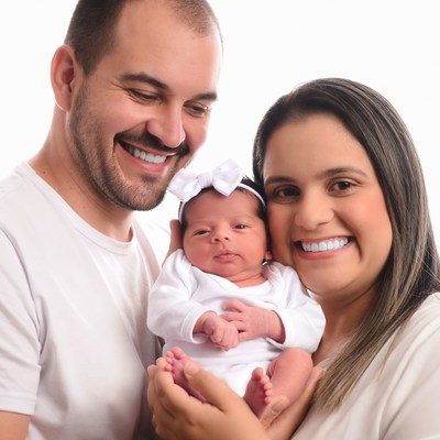 Family holding newborn baby