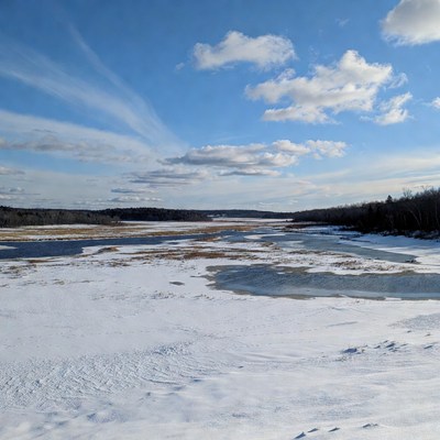 Frozen River in Snowy Landscape