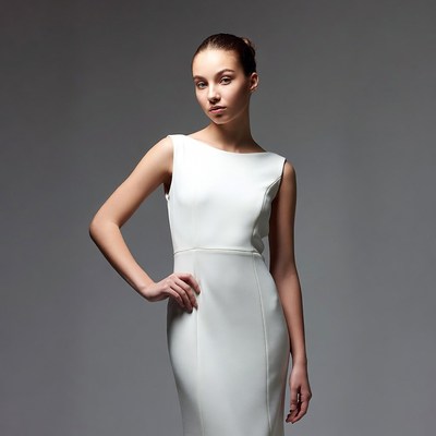 Young woman in white sleeveless dress