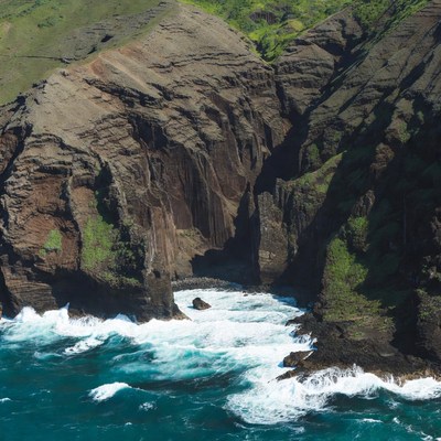 Ocean Waves Crashing Volcanic Cliffs