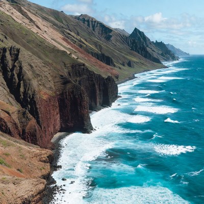 Dramatic Red Cliffs and Ocean Waves
