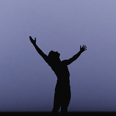 Man raising arms silhouette