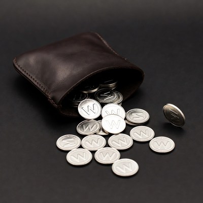 Brown leather wallet spilling silver W coins