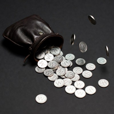 Brown leather pouch spilling silver coins
