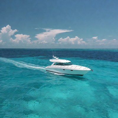 White yacht speeding in turquoise ocean