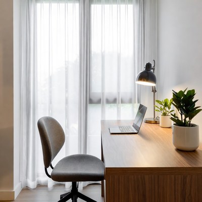 Modern Desk with Laptop and Lamp