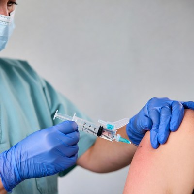 Nurse administering vaccine injection