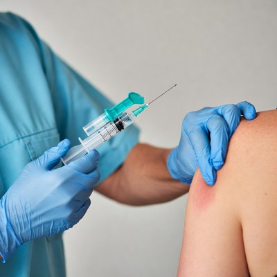 Nurse administering shoulder injection
