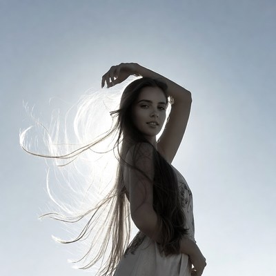Woman with flowing hair in sunlight