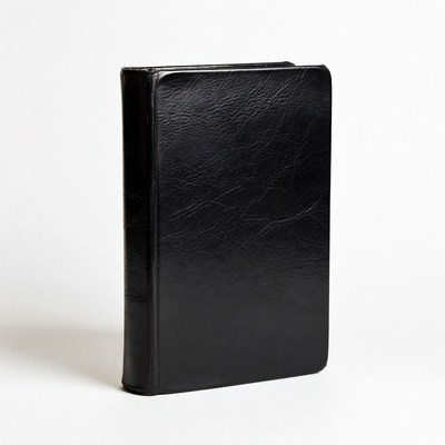 Black leather book on white background