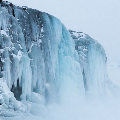 Frozen Waterfall in Snowy Landscape
