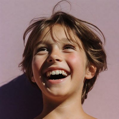 Boy laughing with wide smile