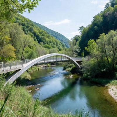 Arch Bridge over River in Green Valley