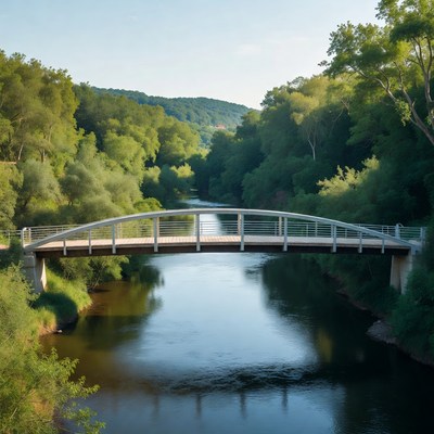 White pedestrian bridge over river