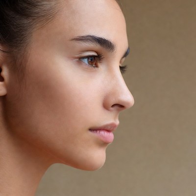 Woman's profile with brown eyes