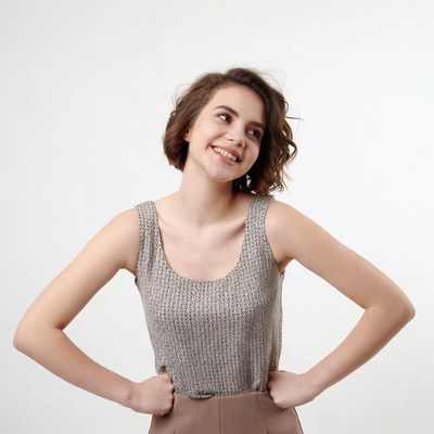 Smiling young woman hands on hips