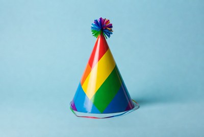 Rainbow Party Hat on Blue Background