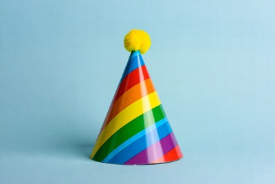 Rainbow Party Hat with Yellow Pom Pom