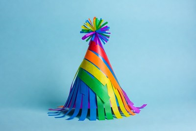 Rainbow Party Hat on Blue Background