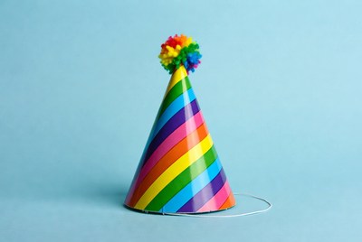 Rainbow Party Hat on Blue Background