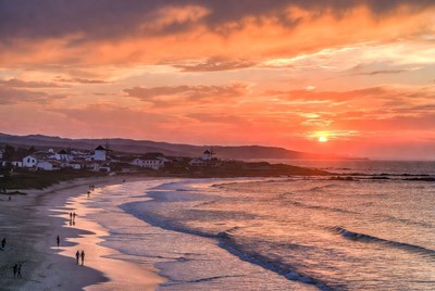 Sunset Beach with White Windmills