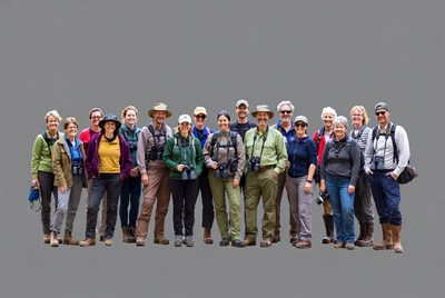 Group of birdwatchers with binoculars and hats