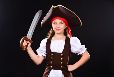 Girl in pirate costume holding sword