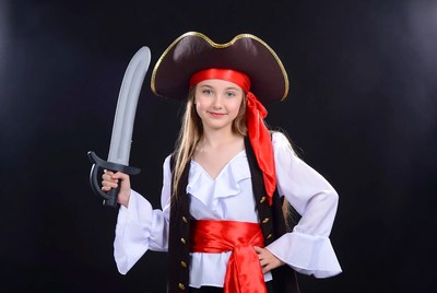 Girl in pirate costume holding sword