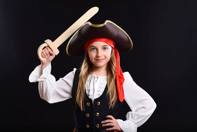 Girl in pirate costume holding sword