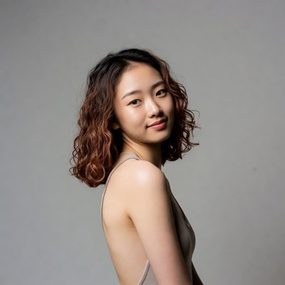 Asian woman with curly hair profile