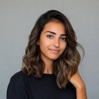 Smiling woman with wavy brown hair