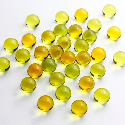 Yellow Green Glass Marbles on White
