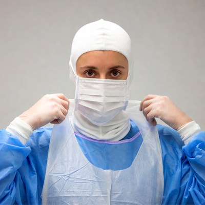 Woman holding surgical mask