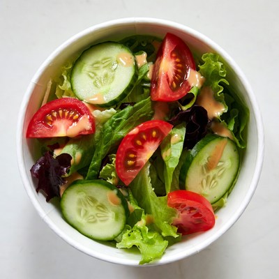 Fresh salad in white bowl