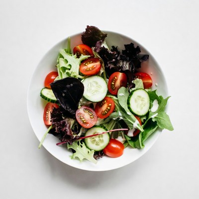 Fresh salad in white bowl