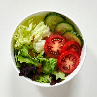 Fresh salad in white bowl