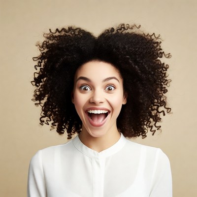Excited African-American woman with curly hair