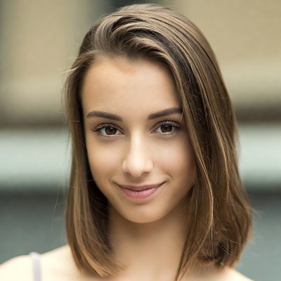 Smiling young woman with brown hair