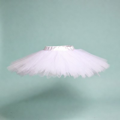 White tutu skirt on green background