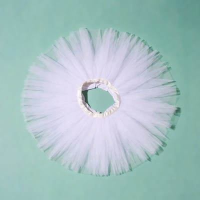 White tutu skirt on green background