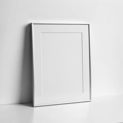 Empty Silver Frame on White Wall
