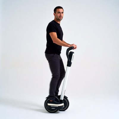 Man riding white electric unicycle