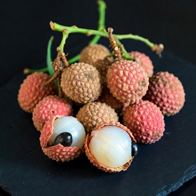 Fresh Lychee Fruits on Black Background
