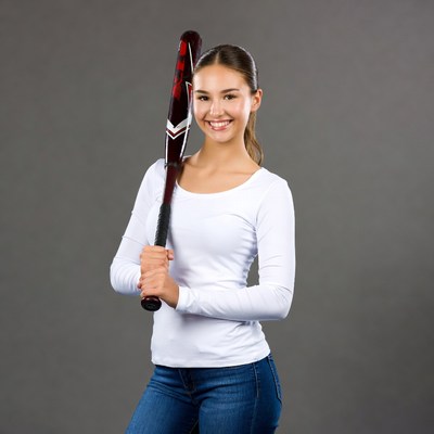 Smiling girl holding baseball bat