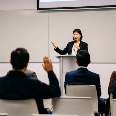 Asian woman speaking at conference